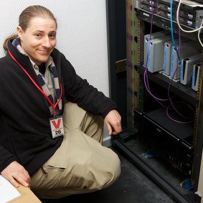 Henri installing a DroboPro into a rack, to replace the individual LaCie disks above it.